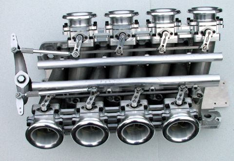 1972 Ford Ranchero - A close-up view of a performance cross ram intake manifold, four carburetors and intricate linkage.