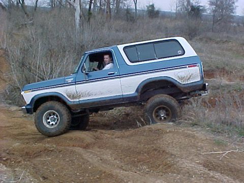 1990 Ford Bronco - This Ford Bronco is navigating a challenging off-road course.