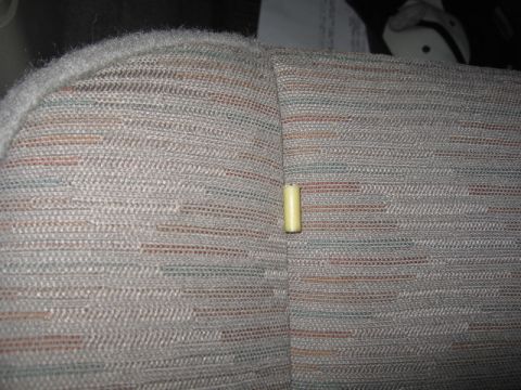 2005 Jeep YJ - The interior seat fabric features a multi-colored woven pattern. A small yellow cylindrical object is visible on the seat seam.