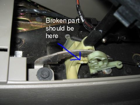 2005 Jeep YJ - Broken shift linkage part shown inside a vehicle's interior.