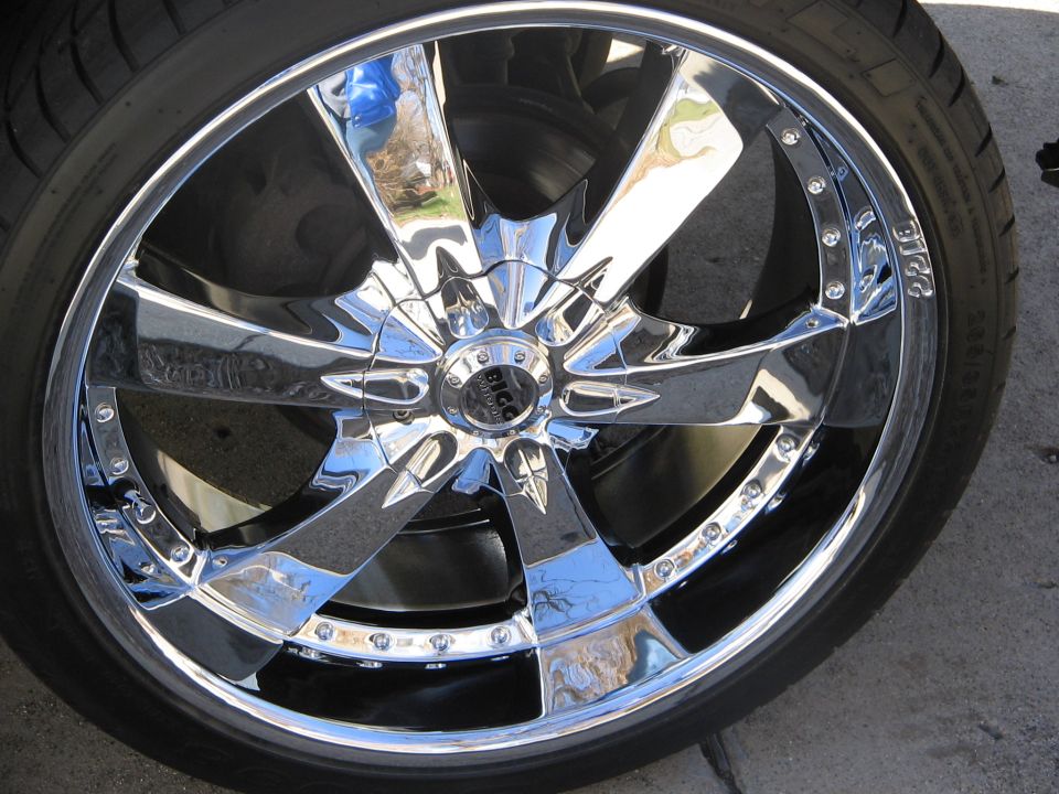 Close-up of chrome BICC multi-spoke wheel with low-profile tire on a vehicle