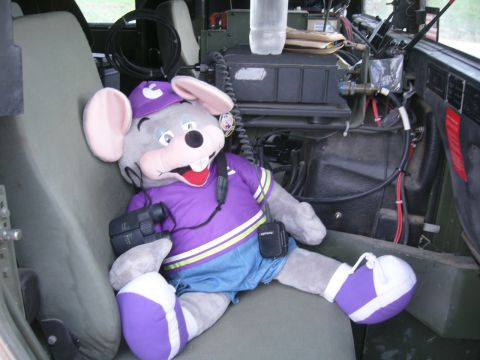 1996 Ford Probe - A mascot doll sits in the interior of a military vehicle, accessorized with binoculars and a radio.