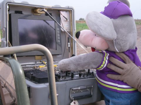 1996 Ford Probe - A plush toy is shown interacting with electronic equipment, possibly in a field setting.