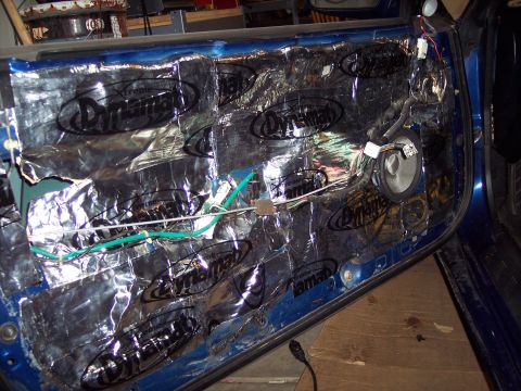 1995 Ford Probe - Interior of a car door with sound dampening material applied to the inner panel.