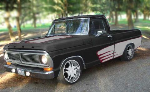 2002 Ford Crown Victoria - Customized Ford F-Series pickup truck with a two-tone paint scheme and aftermarket wheels.