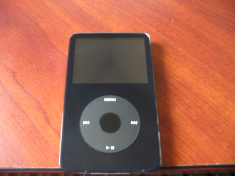 1991 Ford Bronco - An iPod Classic sits on a wooden surface.