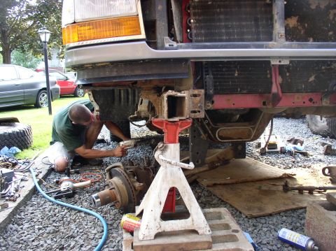 1996 Ford F-250 - Front end work on a 1996 Ford F-250, with the vehicle supported by jack stands.