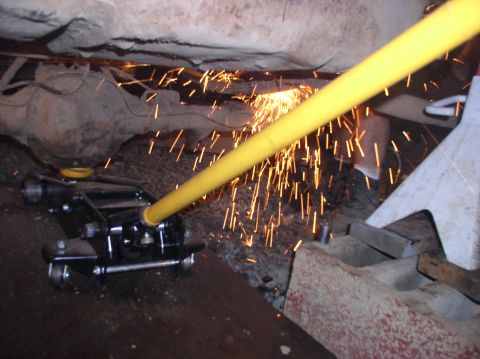 1996 Ford F-250 - Sparks fly as work is done on the undercarriage of a vehicle.