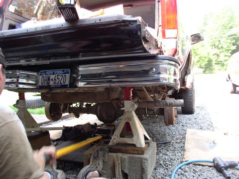 1996 Ford F-250 - Rear view of a 1996 Ford F-250 being worked on, supported by jack stands.