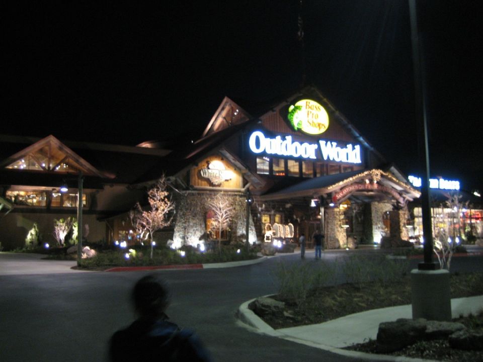 Building with illuminated sign at night