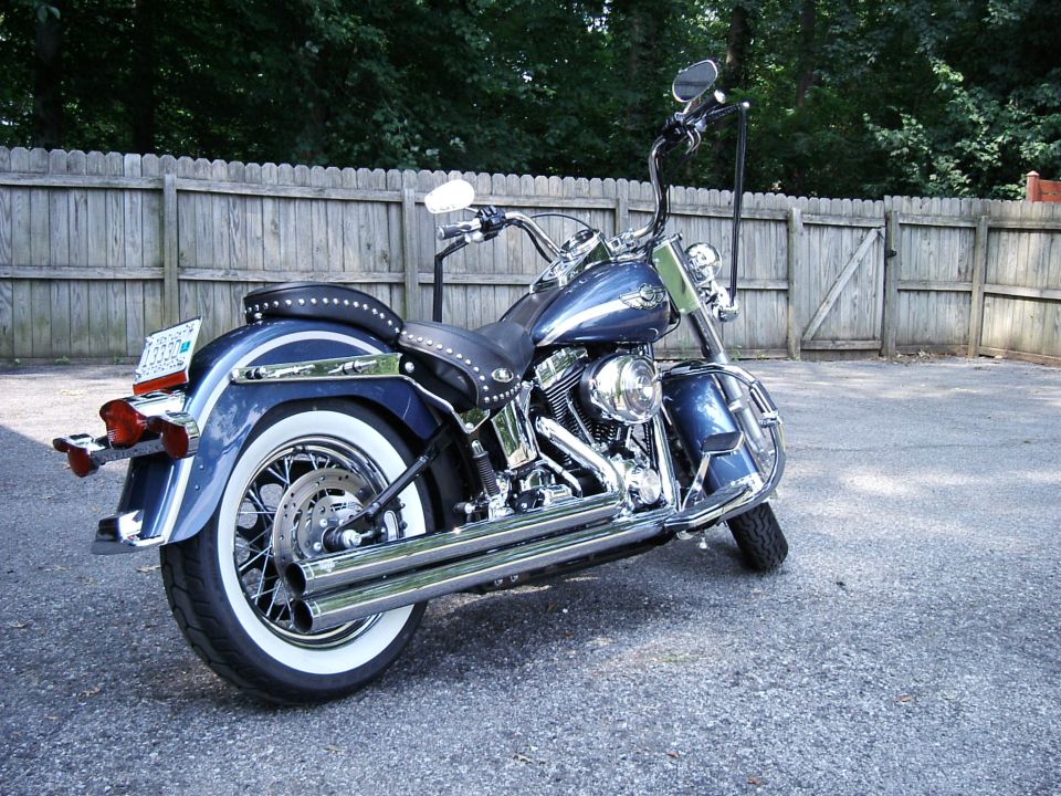 Blue 2003 Harley-Davidson Softail motorcycle parked outdoors