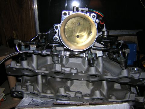 1979 Ford Bronco - Throttle body and intake manifold assembly, likely for a V8 engine.