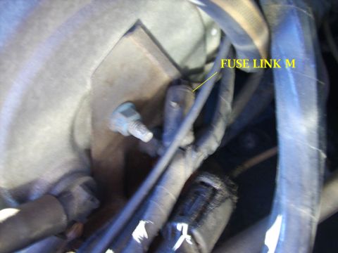 1982 Ford LTD Crown Victoria - This I believe is Fuse Link M, which you can see in the pages from the EVTM. It is next to the cruise control servo, which can be partially…
