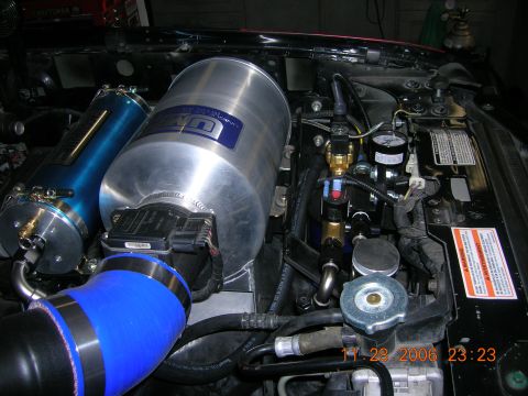 1996 Ford Bronco - Aftermarket air intake and air compressor components visible in the engine bay. Date stamp visible.