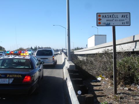 1993 Ford Taurus - Traffic jam on the freeway with a police car present, near Haskell Ave.