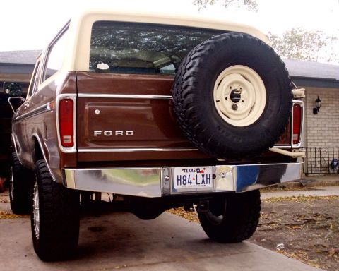 1979 Ford Bronco - This Ford Bronco features a two-tone paint scheme and a rear-mounted spare tire.