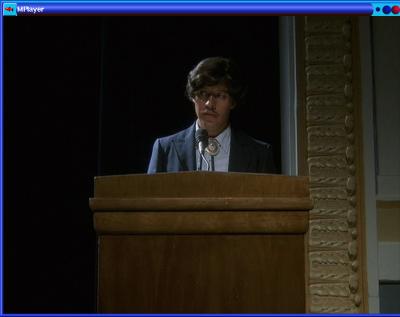 1991 Ford Bronco - A man addresses an audience from behind a podium.