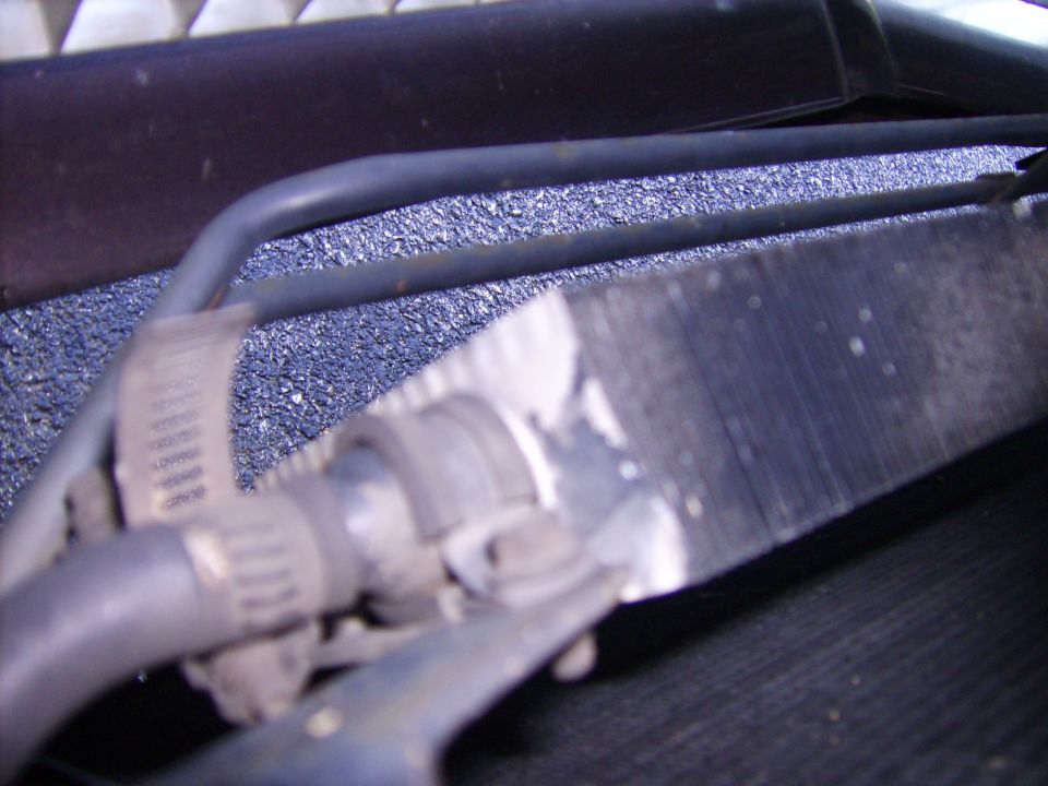You can see both the Power Steering cooler and the tranny cooler in this picture.