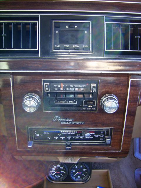 1982 Ford Crown Victoria LTD - Interior view of a 1982 Ford Crown Victoria LTD showing the dashboard with radio, climate controls, and auxiliary gauges.