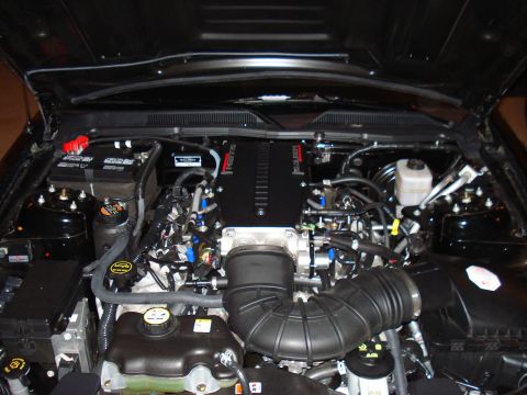 1998 Ford Taurus - Engine bay detail with various components and hoses visible. Supermotors.net branding present.