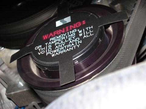 1998 Ford Taurus - This pulley has a warning sticker about voiding the powertrain warranty if removed.
