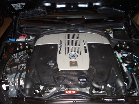 1998 Ford Taurus - Close-up view of a Mercedes-Benz AMG engine, highlighting its intricate components and carbon fiber detailing.