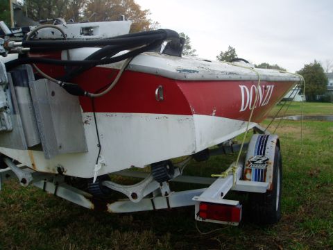 1978 Ford F-250 - Donzi boat on a trailer, with Supermotors.net logo visible on the fender.