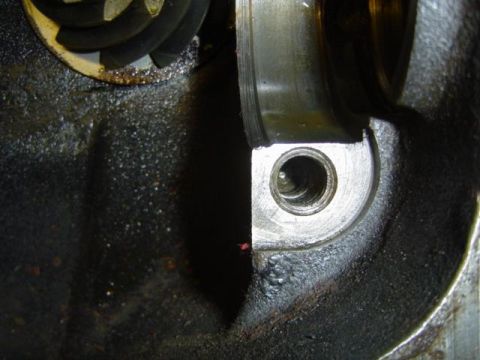 1979 Ford Bronco - Close-up view of an engine component, showing gears and oil residue.