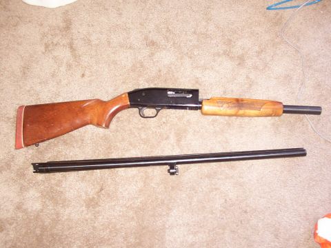 1978 Ford Bronco - Shotgun disassembled into receiver and barrel components, laid out on carpet.