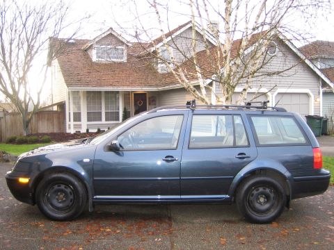 2005 Volkswagen Jetta - This dark blue 2005 Volkswagen Jetta wagon is parked in front of a suburban home.