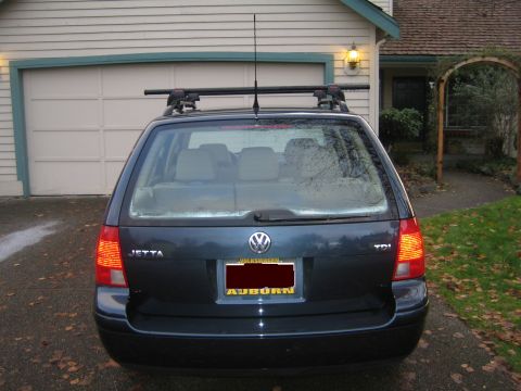 2005 Volkswagen Jetta - Rear view of a dark blue 2005 Volkswagen Jetta TDI wagon equipped with a roof rack.