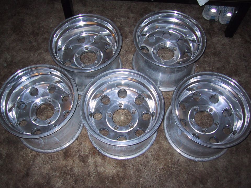 Five polished aluminum alloy wheels with ten lug holes