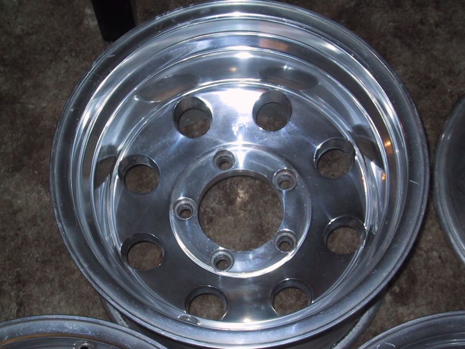 Close-up of a single aluminum wheel with 8 lug holes