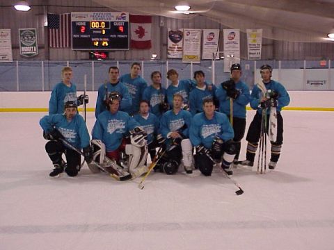 1985 Ford LTD Crown Victoria - A hockey team poses for a photo on the ice in front of a scoreboard.