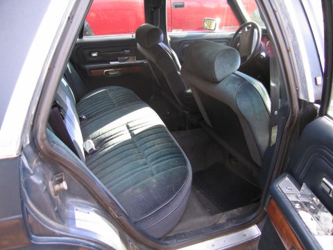 1991 Ford LTD Crown Victoria - Interior view of a 1991 Ford Crown Victoria LTD, highlighting the velour seating and dashboard details.
