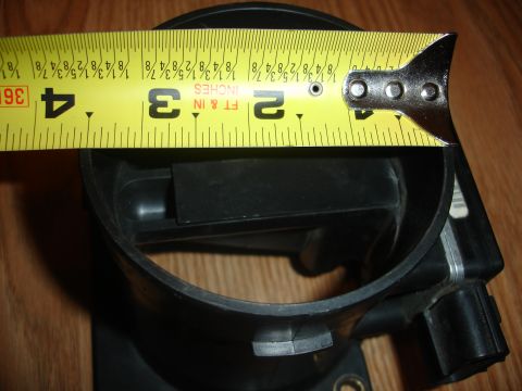 1993 Ford Taurus - Measuring the intake diameter of a mass air flow sensor housing.