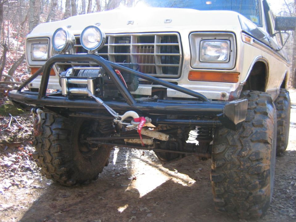 Front view of a 1979 Ford F-Series truck with a winch and off-road tires