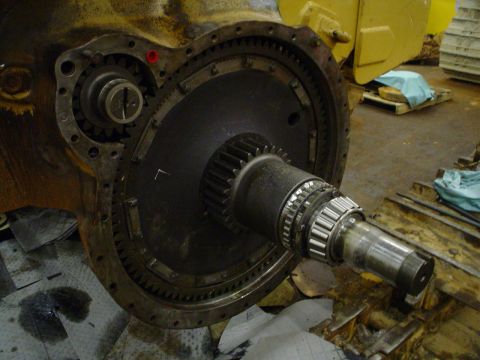 1966 International School Bus - Disassembled transmission part, likely from heavy machinery, showing internal gears and bearings.