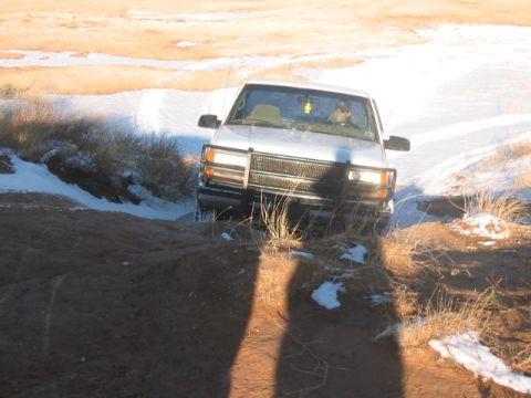 2003 Ford Ranger - Front view of a 2003 Ford Ranger navigating a snowy, off-road trail.