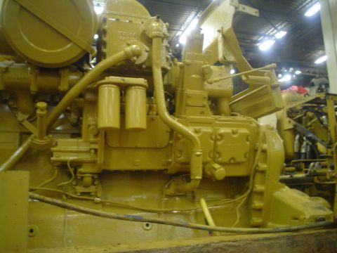 1966 International School Bus - Close-up view of a yellow engine assembly with various hoses and filters.