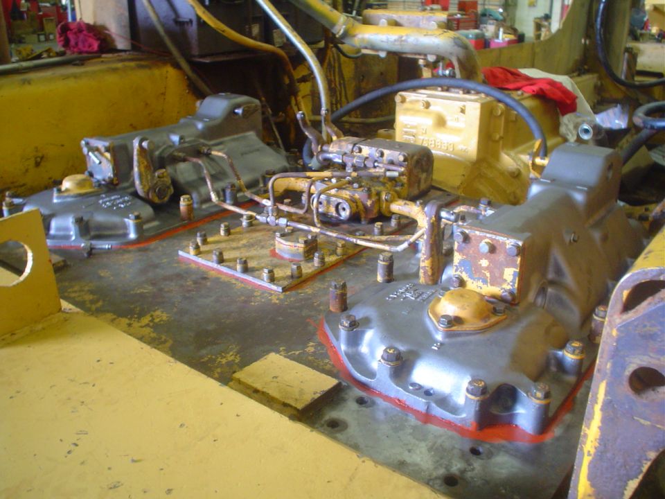 Disassembled transmission and transfer case housings on a shop workbench