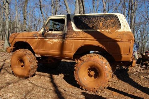 1992 Ford Mustang - This heavily modified Ford Bronco is covered in mud after an off-road excursion.