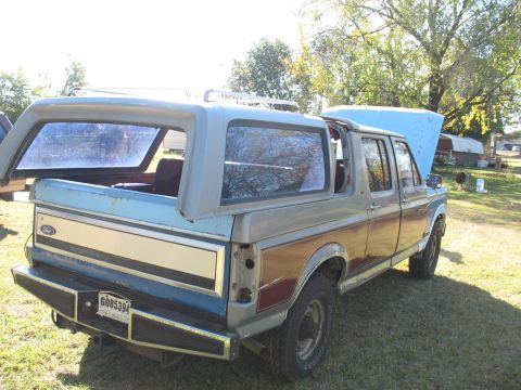 1986 Ford C-350 (Centurion Conversions) - This 1986 Ford Bronco Centurion conversion features a camper shell and a two-tone paint scheme.