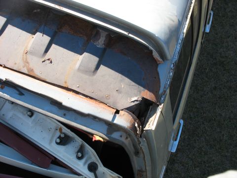 1986 Ford C-350 (Centurion Conversions) - The roof seam of this vehicle shows significant rust and damage, indicating potential weather-related deterioration.