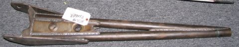 1984 Ford Bronco - A metal suspension component, possibly for a Ford Ranger, is shown with a white identification tag.
