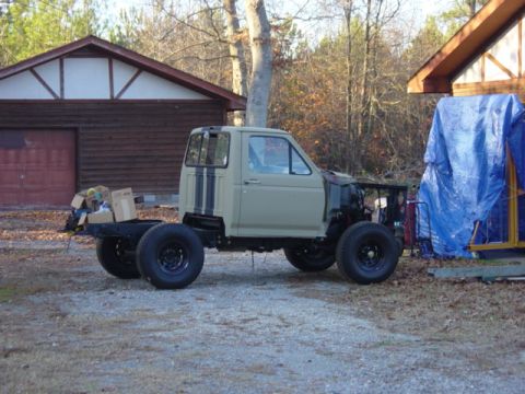 1991 Ford Bronco - 1991 Ford Bronco chassis undergoing reassembly, showing the cab and frame.