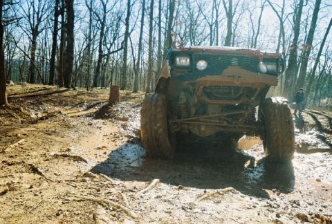 1993 Ford Bronco - This 1993 Ford Bronco is deep in the mud on a wooded trail.