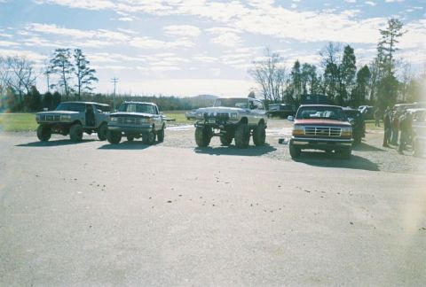 1993 Ford Bronco - This 1993 Ford Bronco is shown lifted with large tires, parked alongside other trucks and SUVs.
