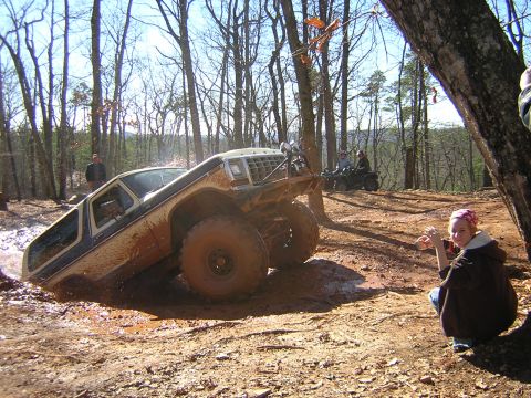 1979 Ford Bronco - A 1978 Ford Bronco navigates a challenging off-road course, kicking up mud as it goes.