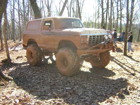 1979 Ford Bronco - This off-road vehicle is covered in mud after a day of trail riding in the woods.
